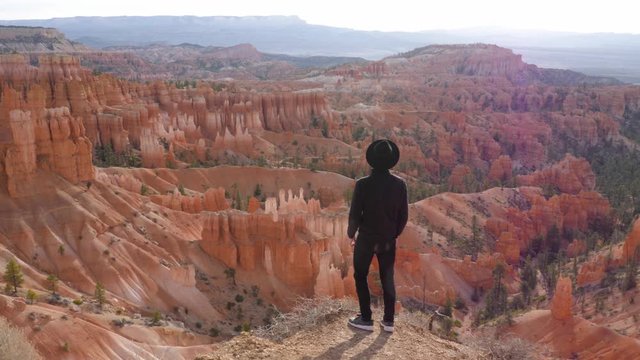Tourist in Bryce Canyon National Park looking at hoodoos in Utah, United States of America - slow motion