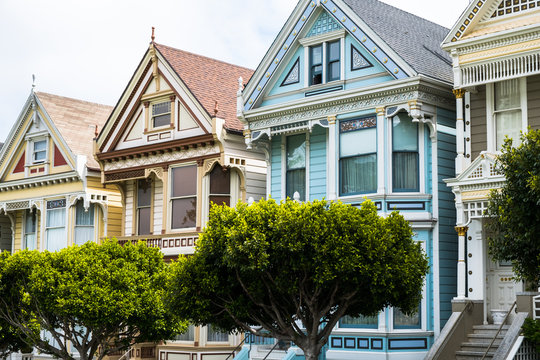 A closeup shot of the iconic Painted Lady homes in San Francisco. The Painted Ladies are Victorian and Edwardian buildings painted in a variety of colors 
