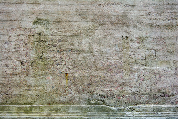 Old rough surface of cement, concrete wall with large sand, stones fractions