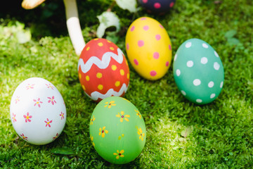 Beautiful Easter multi color egg on garden green grass