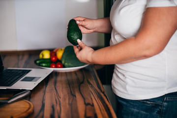 Healthy food, online recipe, culinary video blog. Overweight woman blogger recording cooking video...