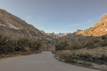 Road traveling through the inyo national park peaks