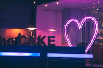 Pink heart with neon lights and Cake from metal letters