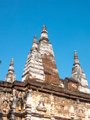 Wat Chet Yot temple,ฺB.E. 1998 King Tilokaraj The 9th King of the Mangrai Dynasty built of laterite decorated with stucco designs. Is a Bodh Gaya pagoda India.