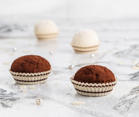Homemade Chocolate truffles candy dessert on light marble background. Delicious praline for...