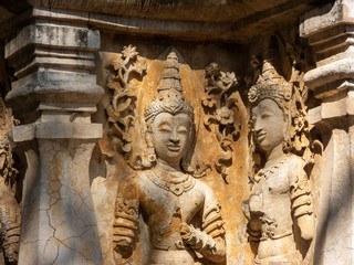 Fototapeta premium Ancient stucco patterns ,Wat Chet Yot temple,B.E. 1998 King Tilokaraj The 9th King of the Mangrai Dynasty built of laterite decorated with stucco designs. Is a Bodh Gaya pagoda India.