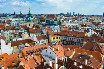 Fototapeta na wymiar Prague, Czech Republic - CIRCA 2013: Prague's rooftops and cityscape as seen from Prague's Old Town Hall Tower.