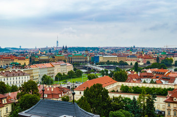 Naklejka na ściany i meble Prague cityscape as seen from Prague Castle. The photo is taken at a cloudy afternoon.