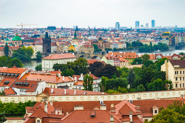 Naklejka premium Prague cityscape as seen from Prague Castle. The photo is taken at a cloudy afternoon.