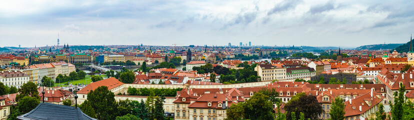 Naklejka na ściany i meble Prague cityscape as seen from Prague Castle. The photo is taken at a cloudy afternoon.