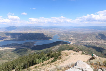 Jordanelle Reservoir with the countryside of Wasatch County as seen from the summit of Bald Mountain at Deer Valley resort in Park City, Utah.