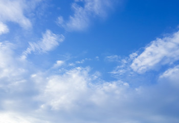 Fototapeta na wymiar White scattered cloud and blue sky