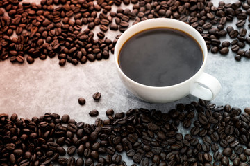 Hot Americano coffee with roasted coffee beans