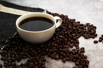 Hot Americano coffee with roasted coffee beans