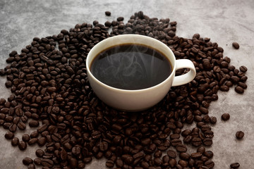 Hot Americano coffee with roasted coffee beans