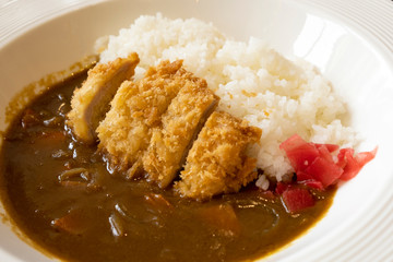 Japanese Curry Rice Deep-fried pork cutlets on a white plate