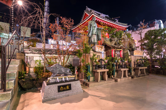 Religious Monuments Of Nichiren Schools Of Buddhism In The Tokudaiji Temple Of Tokyo At Night.