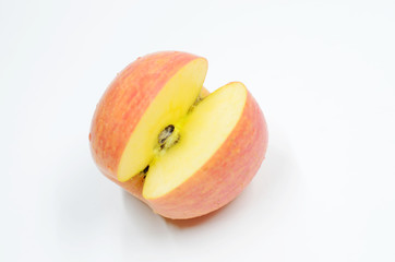 Cut a piece of red apple on the white background