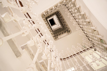 Beautiful Spiral staircase inside an old building. © javiindy