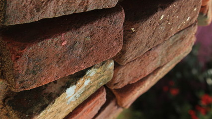 bricks are arranged on the one by one. bricks wall on the unfinished home.