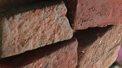 bricks are arranged on the one by one. bricks wall on the unfinished home.