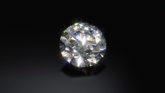 Close up of a rotating cut diamond against a black background. 3D Rendered
