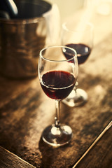 Red wine on wood background..
