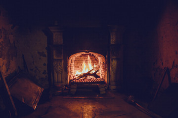 Burning fire in an old manor fireplace