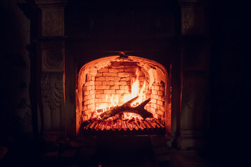 Burning fire in an old manor fireplace