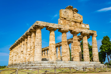 Fototapeta na wymiar Athena (Minerva) Temple in Paestum, Campania, Italy; at a bright summer morning. In ancient times, Paestum is called Poseidonia. 