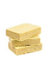 A stack of three sweet wafers isolated on a white background.