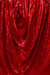 drapery of bright red petal fabric with glitter and soft folds hanging