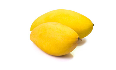 Yellow ripe mangoes on a white background.