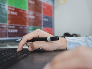 trader use computer explan about  forex and cryptocurrency data and bar chart, invester concept.