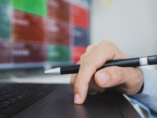 trader use computer explan about  forex and cryptocurrency data and bar chart, invester concept.