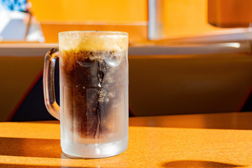 Close up shot of a glass of root beer