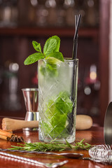 mojito cocktail on a wooden stand