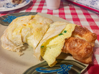 Close up shot of the Taiwanese style egg roll with fried bread stick
