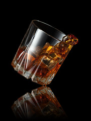 splash of whiskey in glass