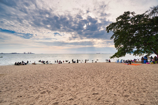 People happy and enjoying picnic under sunny day with family at the beach. Selective focus