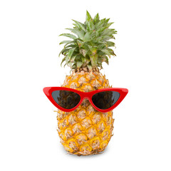 Pine apple wearing red sunglass isolated on white background. Clipping path include in this images.