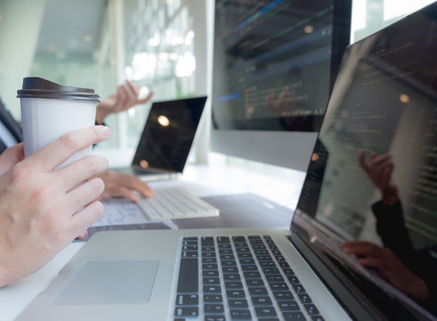 Programmers work on the development of coding and coding technology on white desks and website design, software, data processing companies, servers.