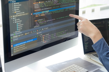 Programmers work on the development of coding and coding technology on white desks and website design, software, data processing companies, servers.