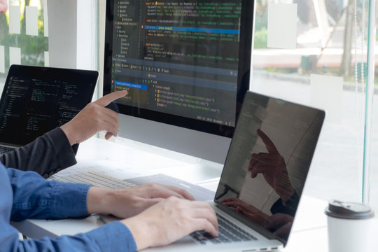 Programmers work on the development of coding and coding technology on white desks and website design, software, data processing companies, servers.