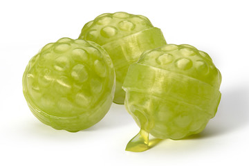 Three caramel balls like raspberries green color