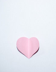 Pink paper heart with white background
