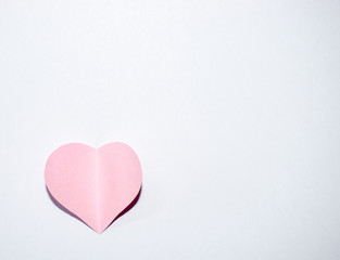 Pink paper heart with white background