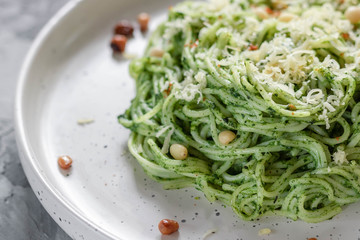 Green pasta with avocado, spinach and pine nuts