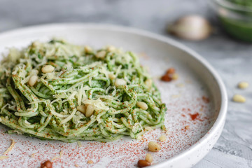 Green pasta with avocado, spinach and pine nuts