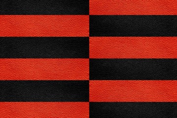 Fototapeta premium Texture of genuine leather. Black and red background.